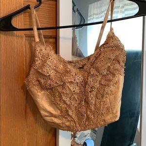 A Bronze crop tank with eyelet lace.